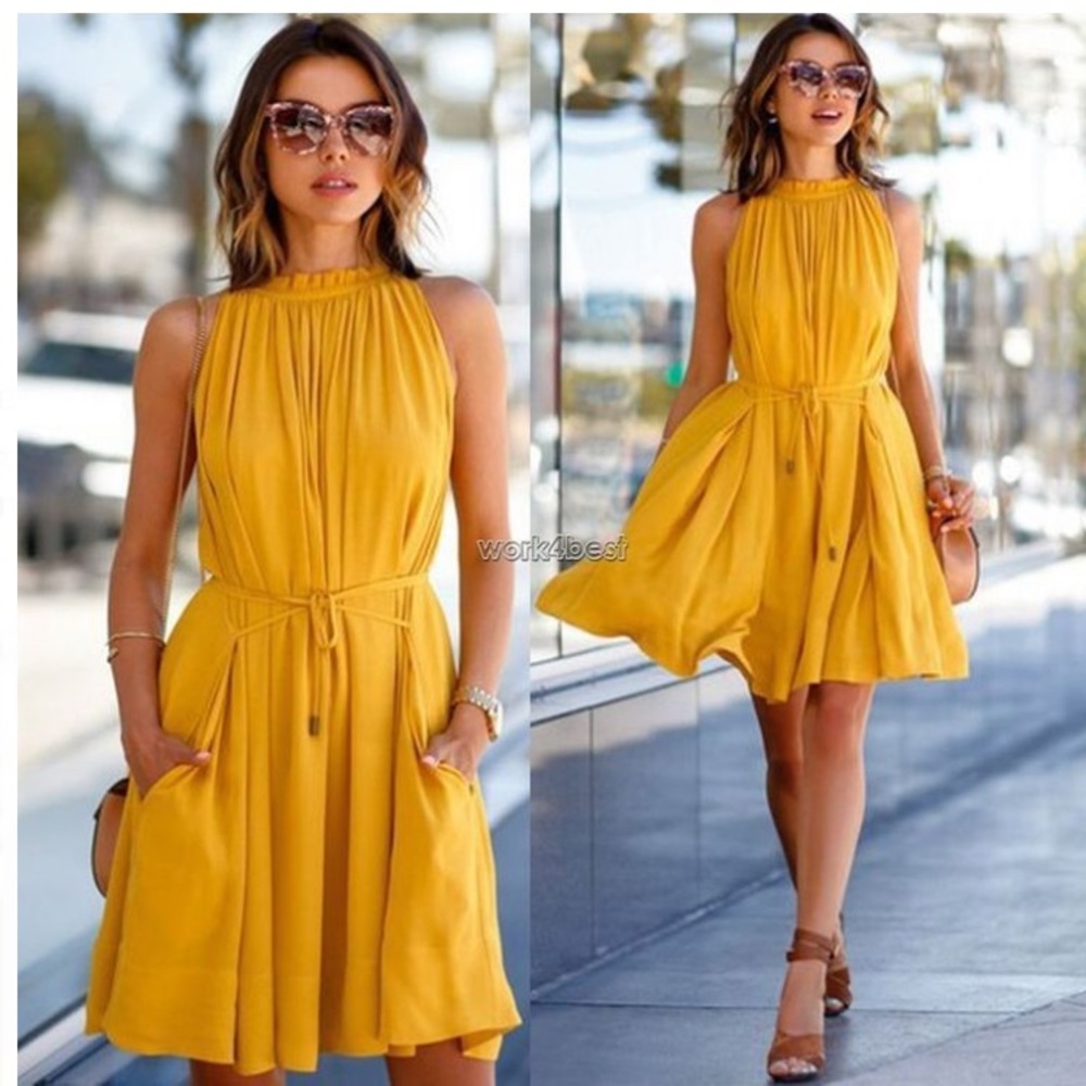 NWOT yellow mini dress. Flowy. Pockets